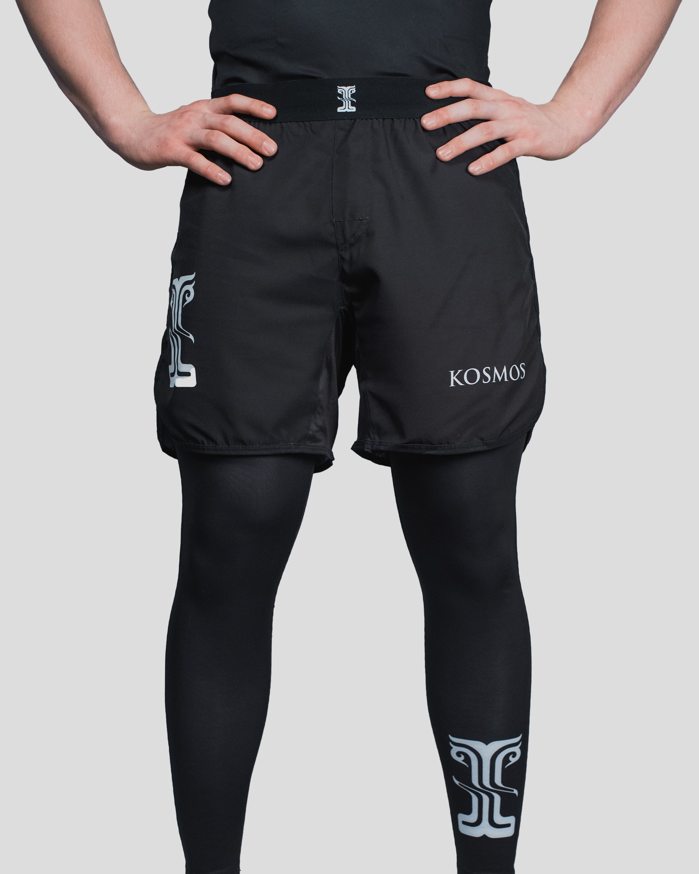 Close-up of the Column Shorts waistband, highlighting the embroidered Kosmos logo and durable elastic fit