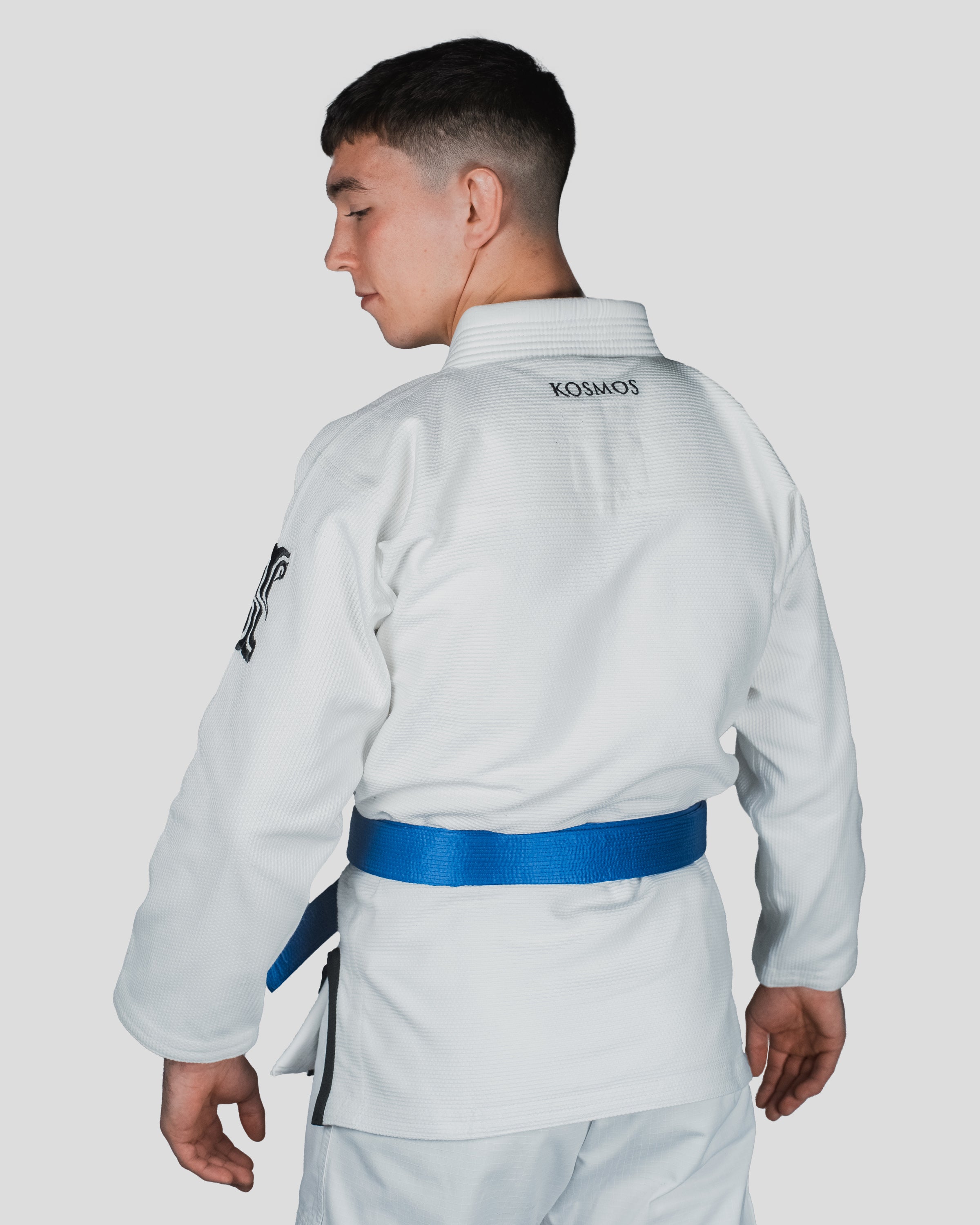 Back view of the Guile Men’s Jiu Jitsu Gi, featuring the Kosmos logo and reinforced collar stitching