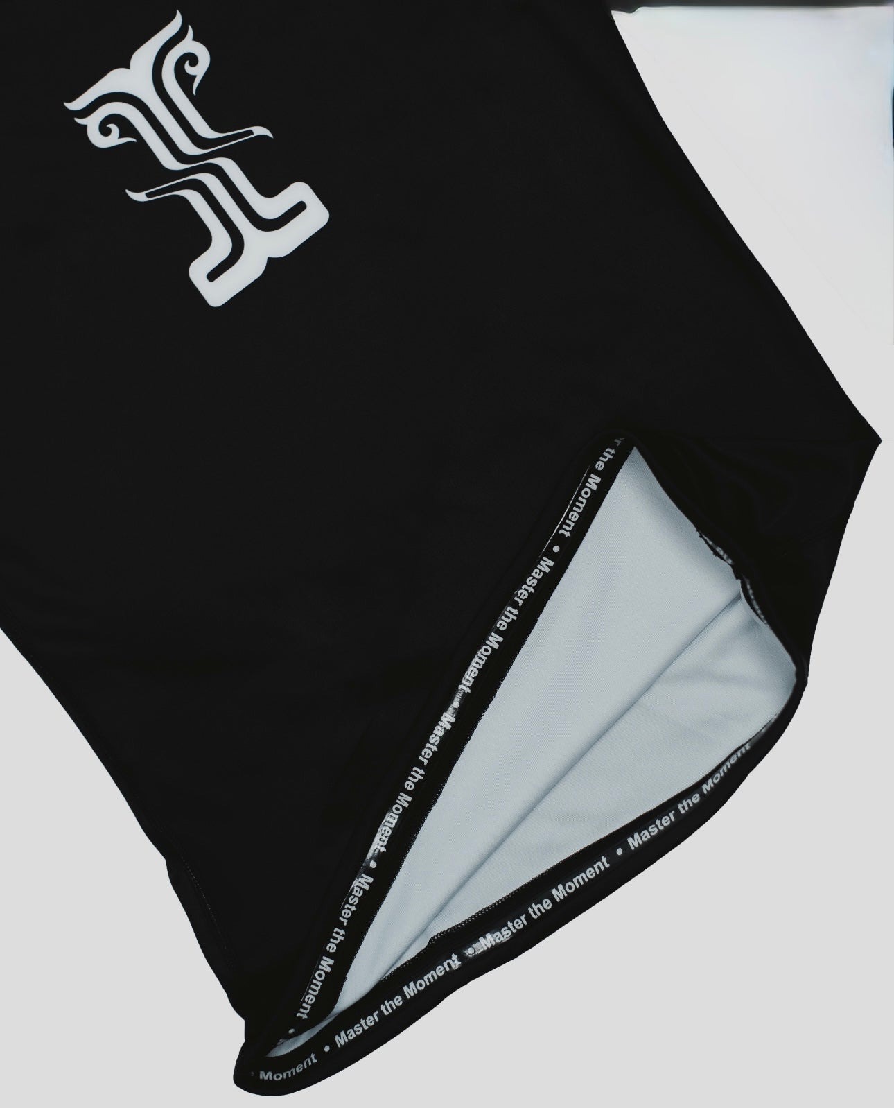 Close-up of the Persist Guard Short Sleeve, showcasing the Kosmos logo and premium inner lining with "Master the Moment" detailing