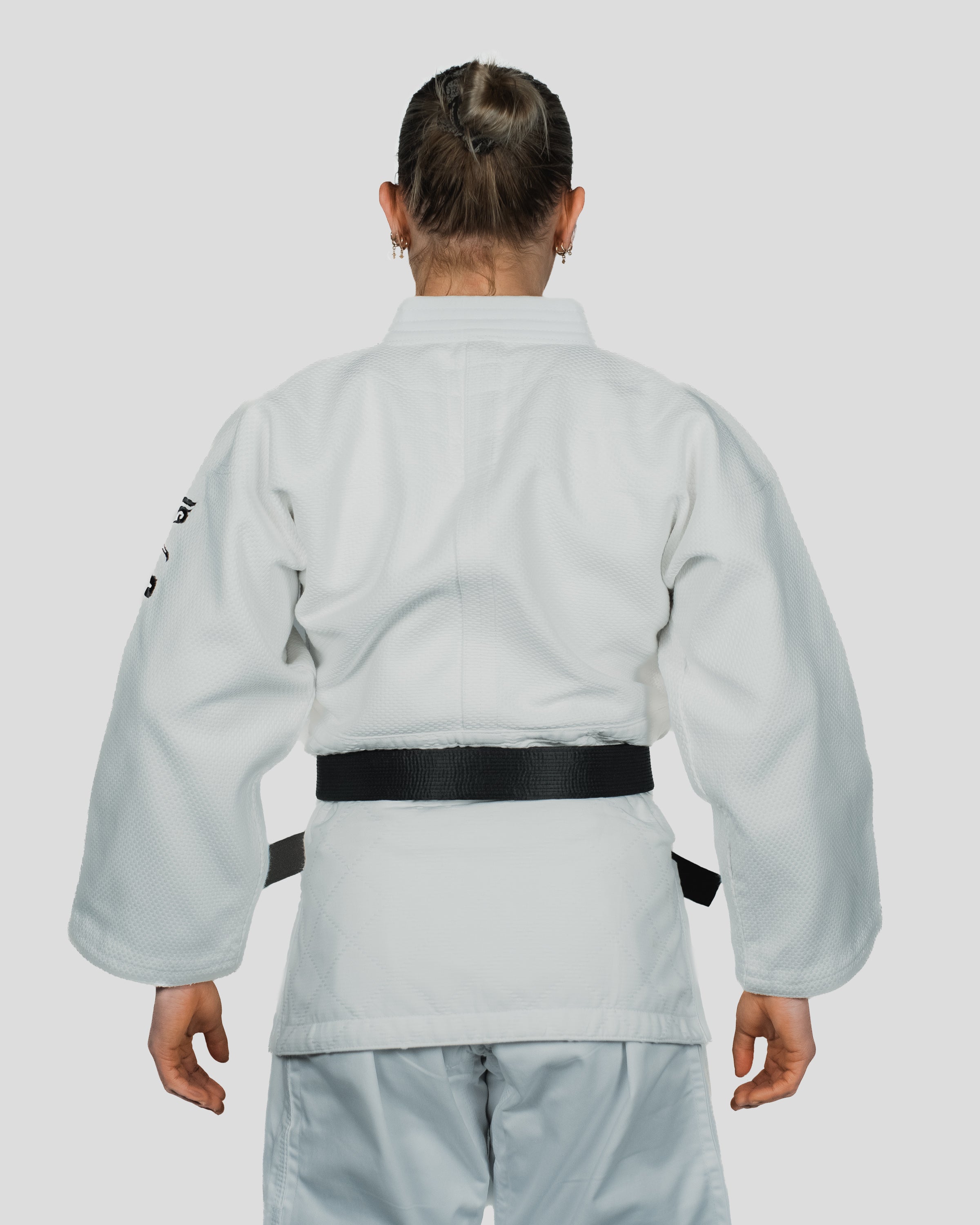 Back view of the Stoa Gi Women's Judo uniform, showcasing the fitted cut and durable stitching