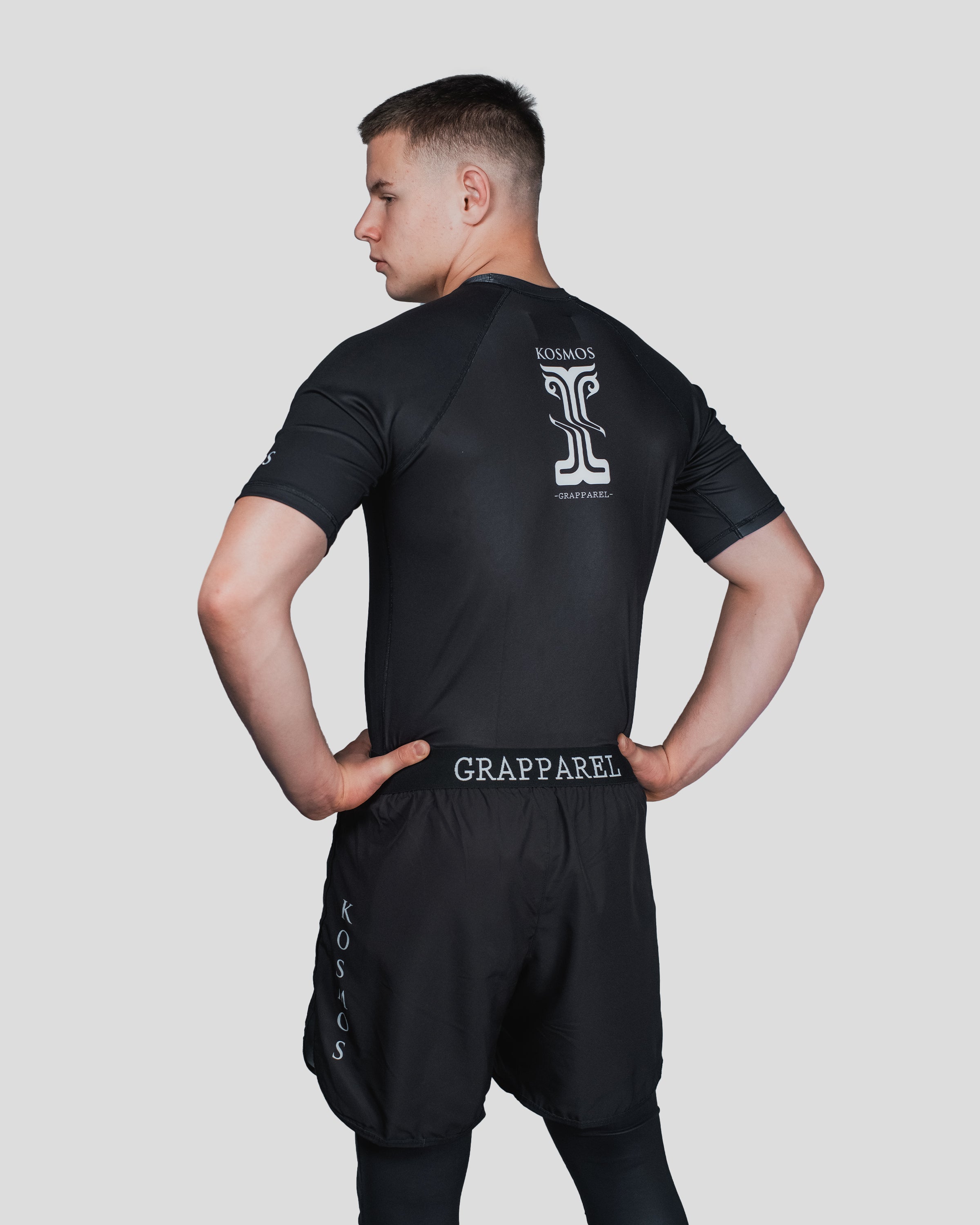 Rear view of Column Shorts featuring the Kosmos and Grapparel label, showcasing the fit and style