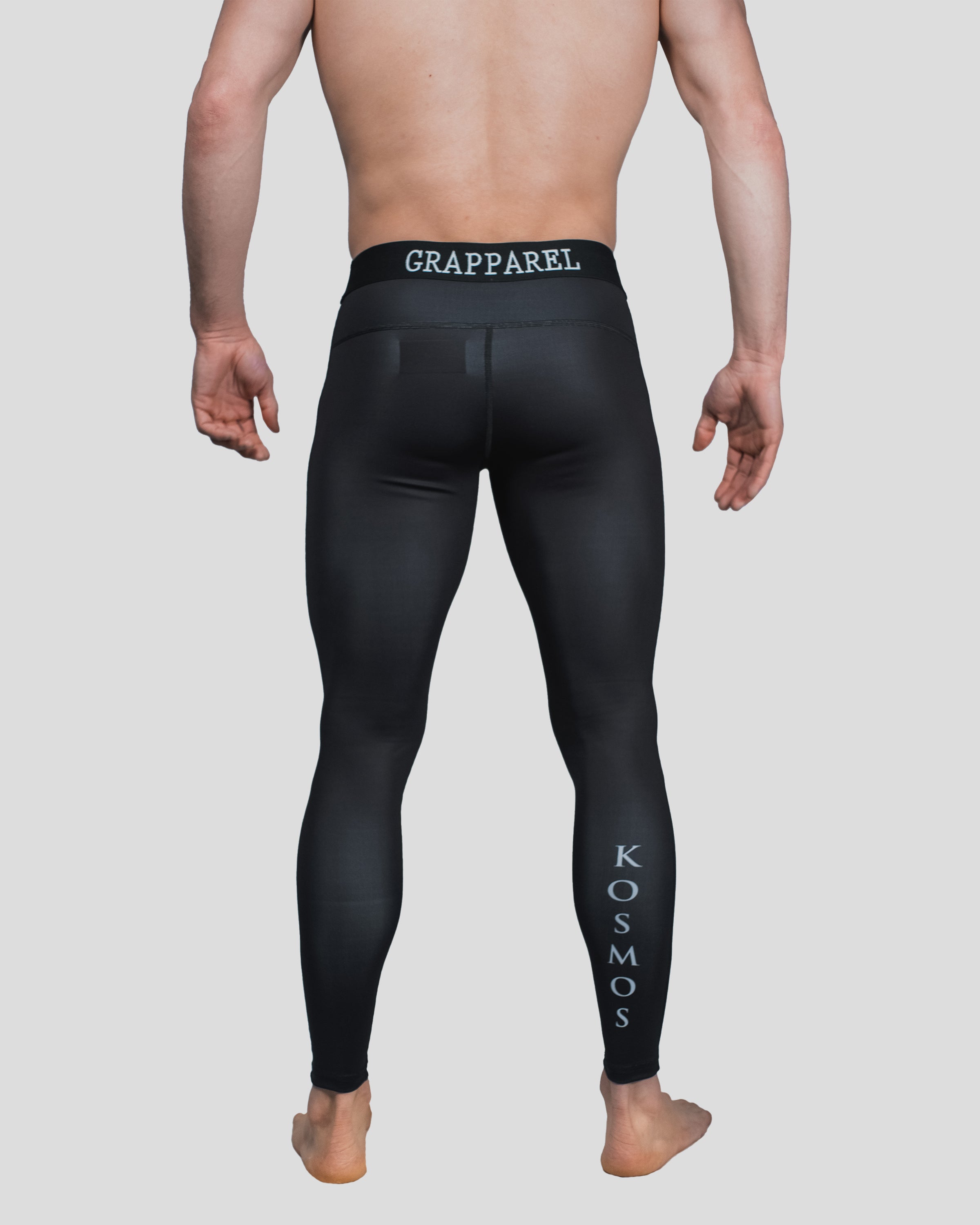 Rear view of the Column Spats, highlighting the grapparel detailed waistband and "KOSMOS" lettering running down the calf