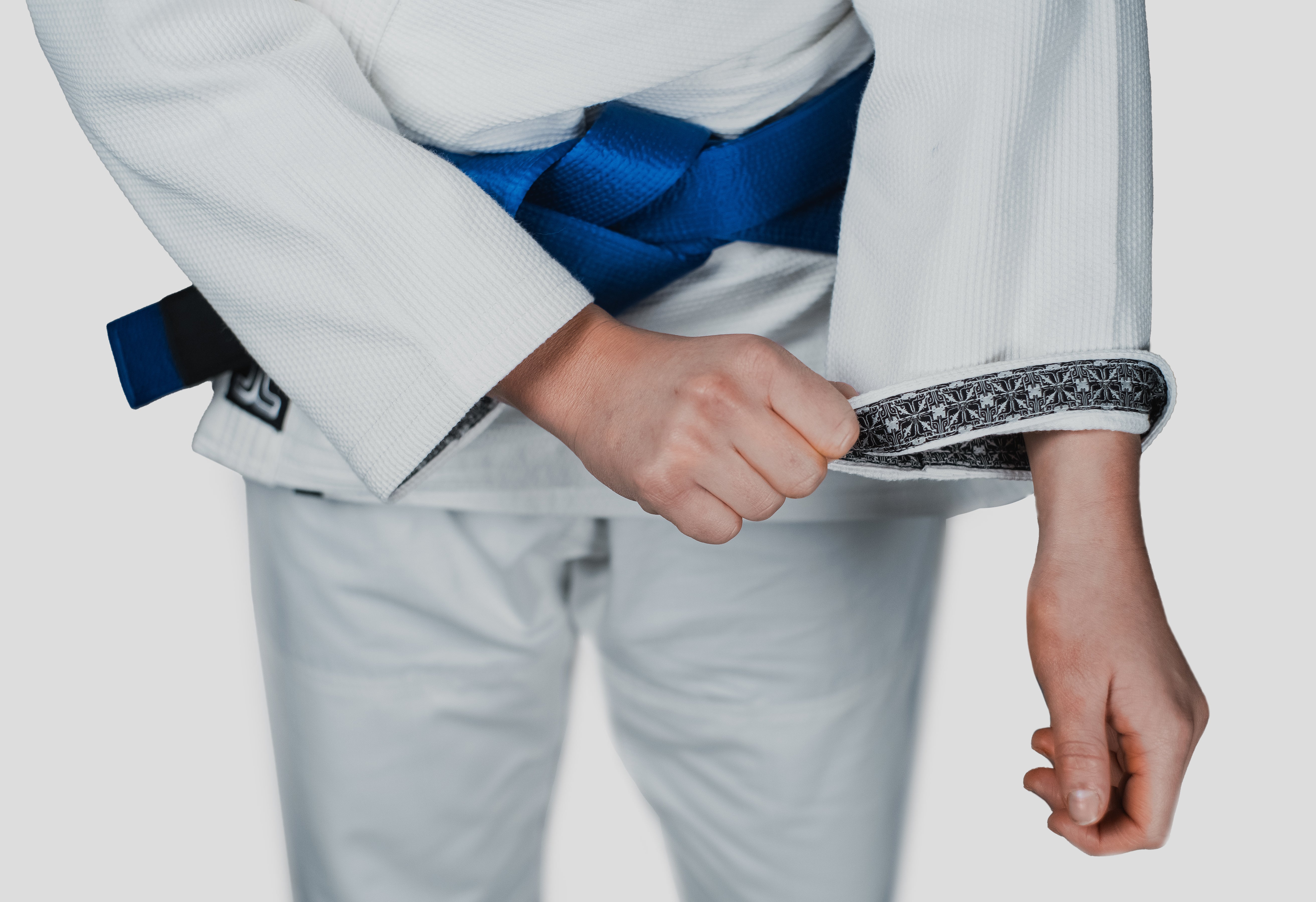 Close-up of the Guile Gi's sleeve cuff, showcasing the patterned inner lining and high-quality stitching for durability