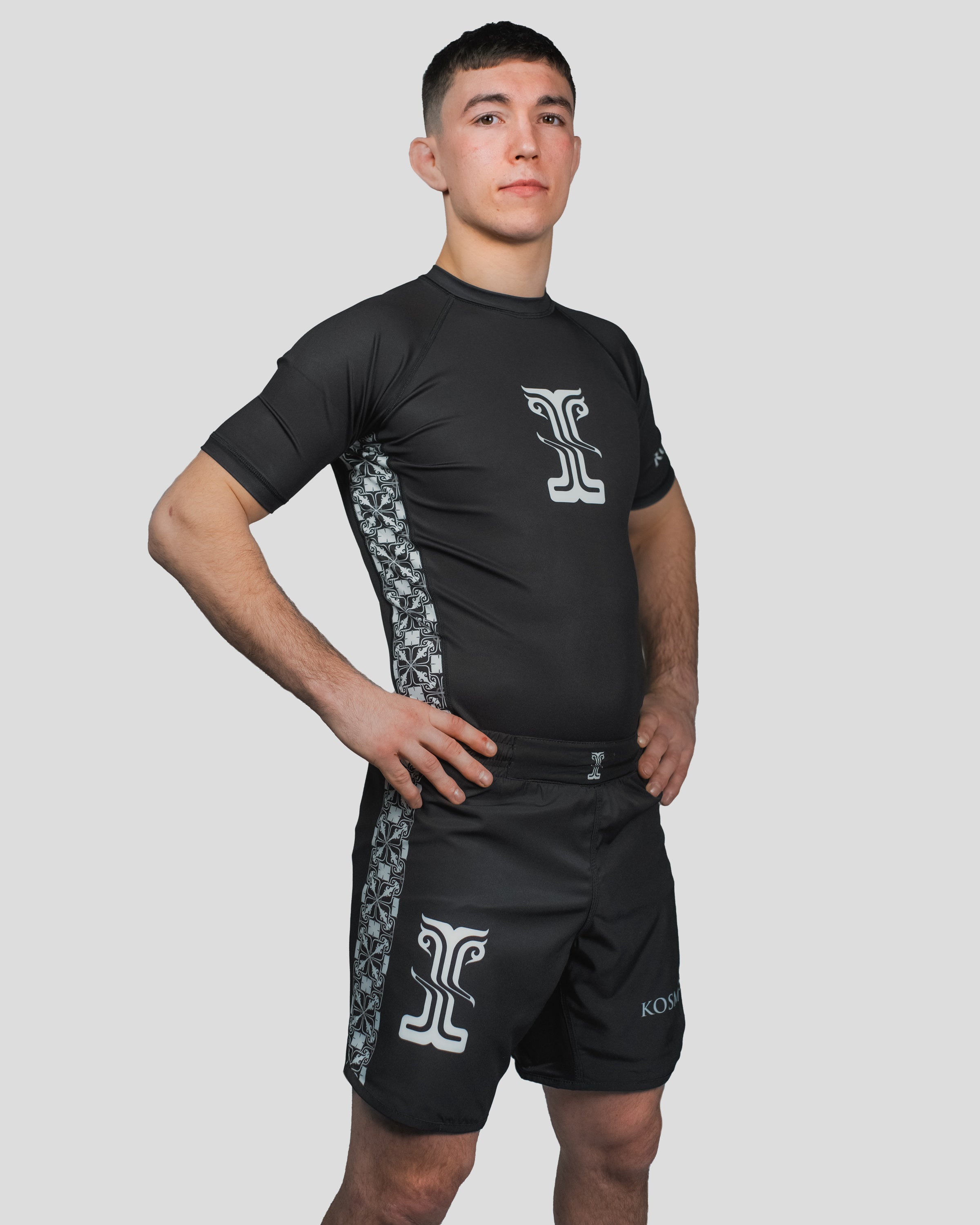Angled view of the Persist Guard Short Sleeve, showing the premium fit, reinforced seams, and breathable fabric for optimal performance