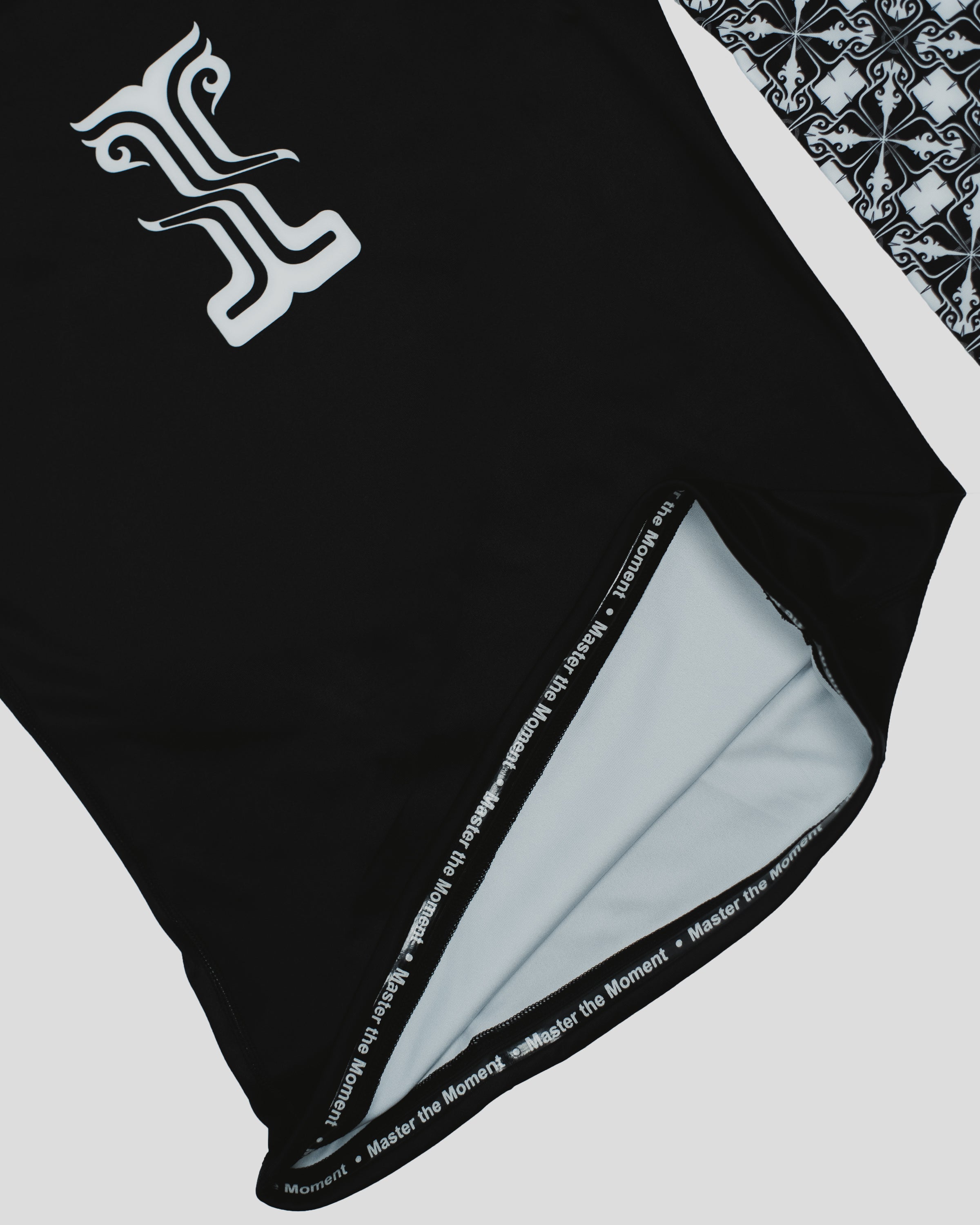Close-up of the Persist Long Sleeve Guard's inner lining, featuring the "Master the Moment" detail and high-quality stitching