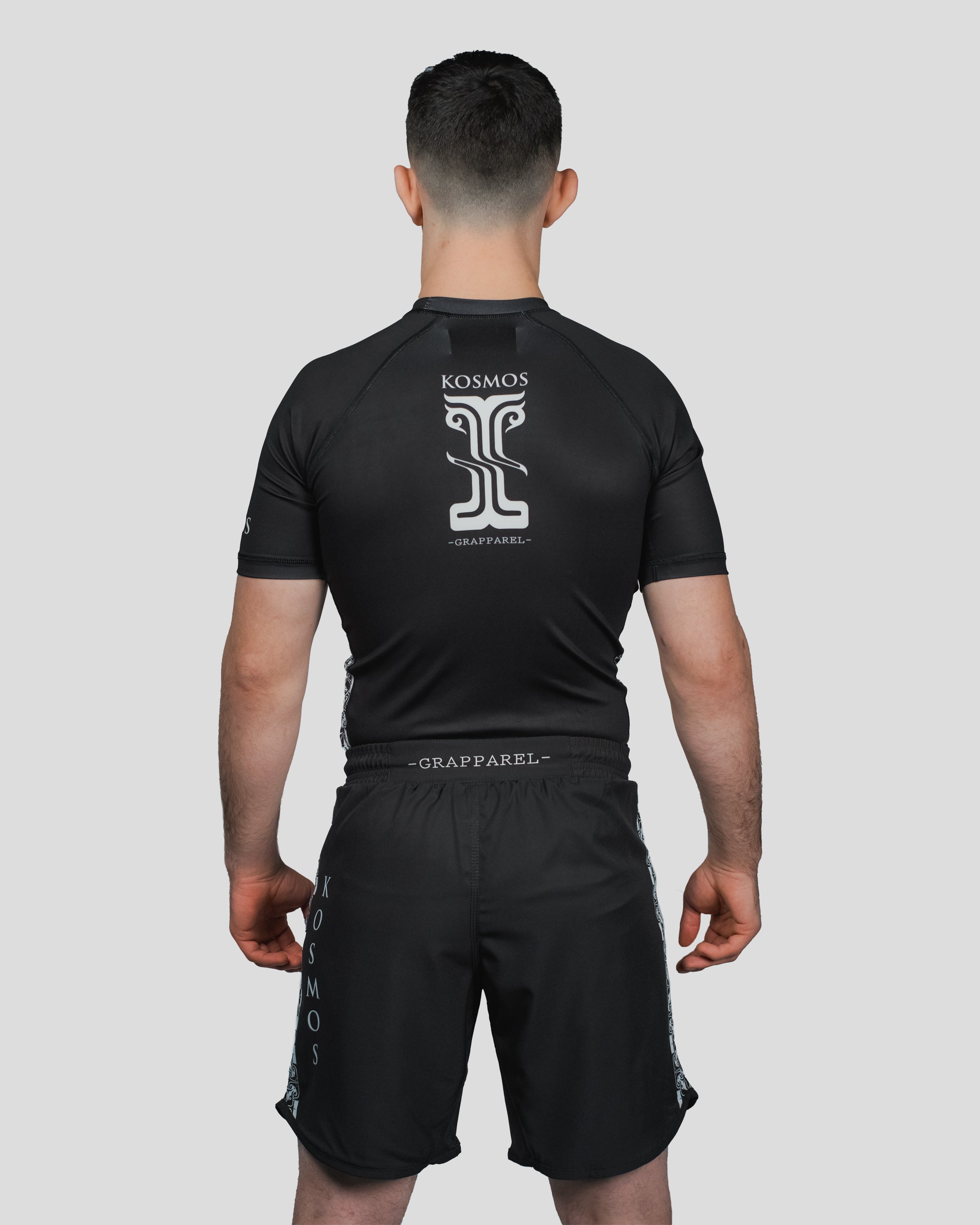 Back view of the Persist Shorts with an elasticated waistband and Kosmos logo, designed for unrestricted movement and comfort