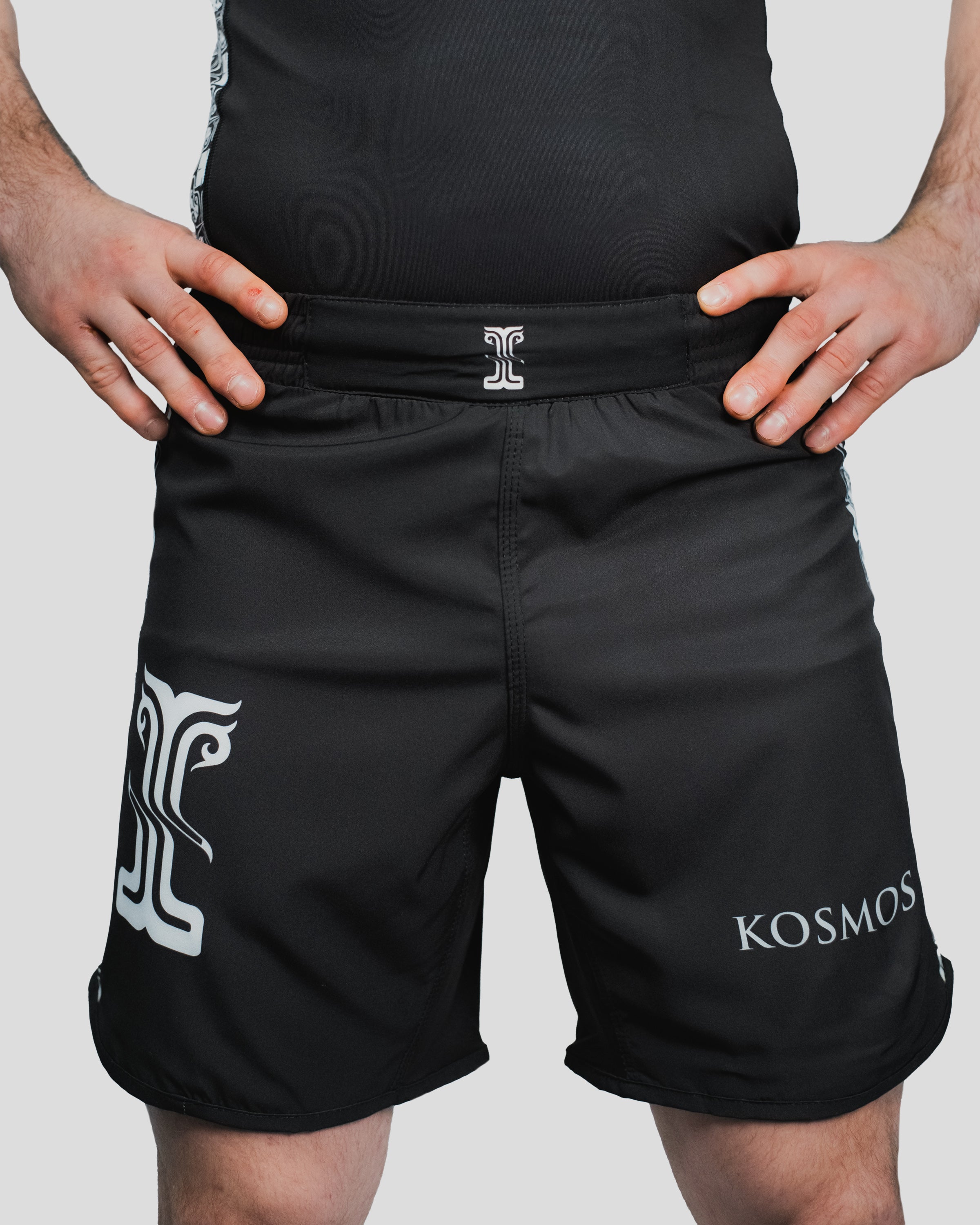 Close-up of the Persist Shorts waistband and branding, highlighting durable fabric and reinforced stitching