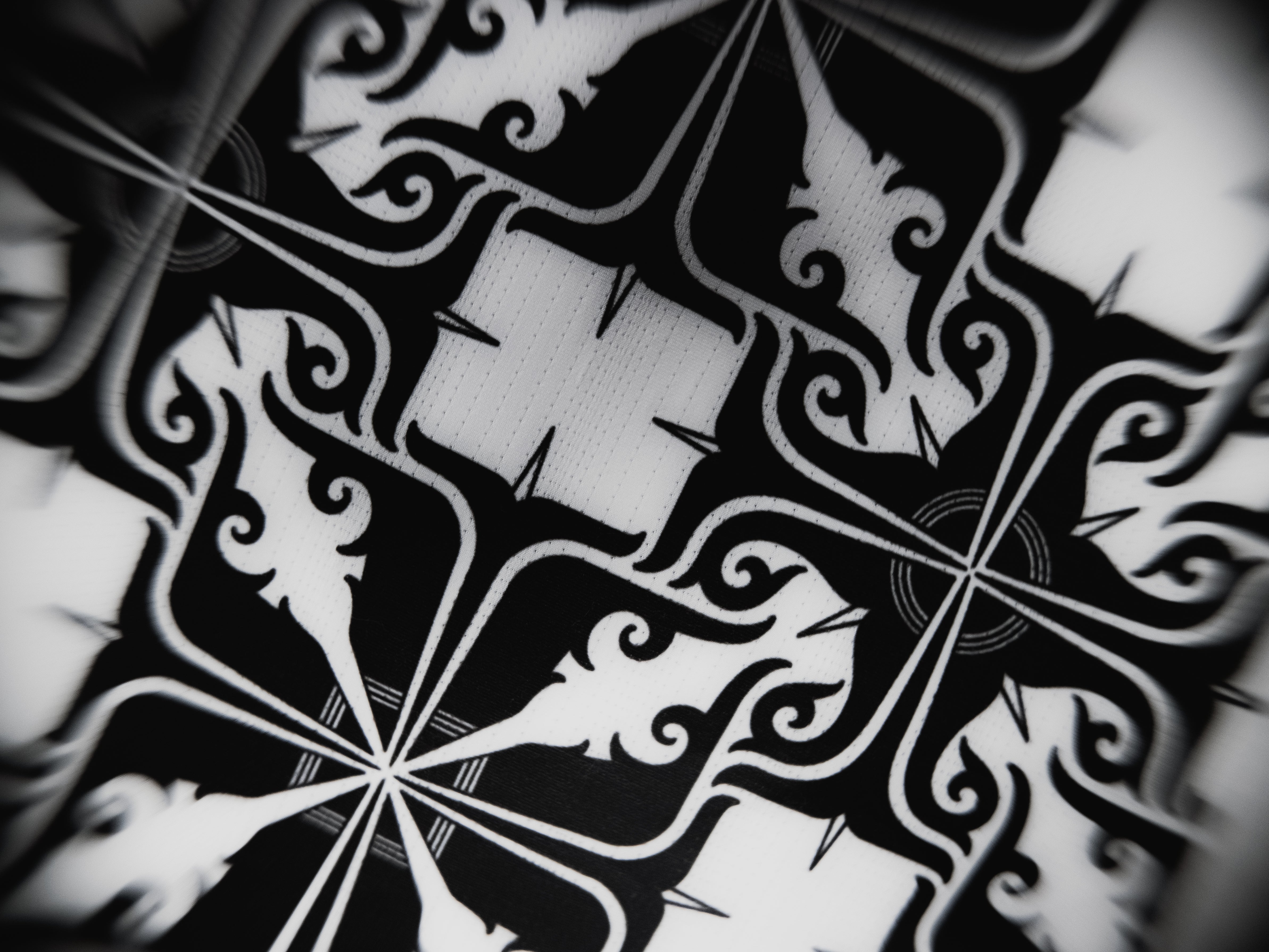 Detailed close-up of the Stoa Gi Women's Judo inner lining pattern, showcasing the intricate black and white artistic design